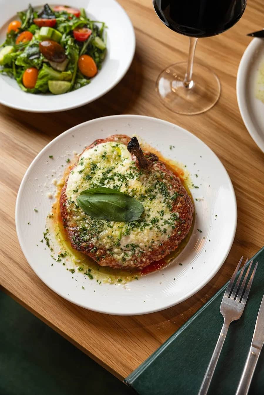 Pollo alla Parmigiana — breaded bone-in chicken with burrata